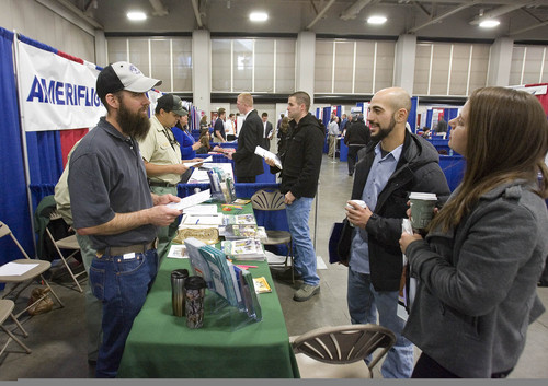 Paul Fraughton  |   Salt Lake Tribune
Mahmoud Awada, right, and his girlfriend Nikki Brown get information about seasonal firefighting jobs with the US Forest Service from Roy Fetzer at the 2013  Hiring Our Heros Job Fair held at the Salt Palace Convention Center in conjunction with The Governor's Military and Family Summit                                                     
 Wednesday, April 17, 2013