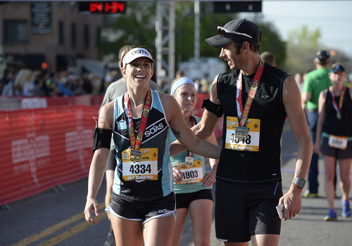 Scott Sommerdorf   |  The Salt Lake Tribune
Moka Best, left, and Dave Swensen finished the Salt Lake City half-Marathon together, Saturday, April 19, 2014.