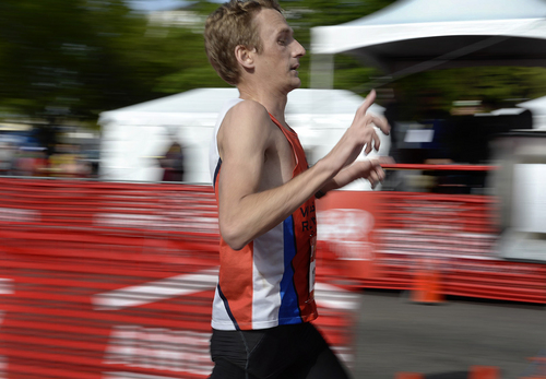 Scott Sommerdorf   |  The Salt Lake Tribune
Fritz Van de Kamp crosses the finish line to win the Salt Lake City Marathon with a time of 2:28:18, Saturday, April 19, 2014.