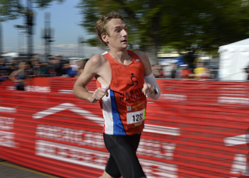 Scott Sommerdorf   |  The Salt Lake Tribune
Fritz Van de Kamp crosses the finish line to win the Salt Lake City Marathon with a time of 2:28:18, Saturday, April 19, 2014.