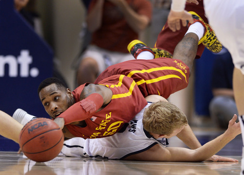 Steve Griffin  |  The Salt Lake Tribune


Iowa State's DeAndre Kane dives over BYU's Tyler Haws as he tries to get a loose ball during second half action in the BYU versus Iowa State men's basketball game at the Marriott Center in Provo, Utah Thursday, November 21, 2013.