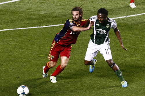 Chris Detrick  |  The Salt Lake Tribune
Real Salt Lake midfielder Kyle Beckerman (5) and Portland Timbers midfielder Kalif Alhassan (11) go for the ball during the first half of the game at Rio Tinto Stadium Friday August 30, 2013.