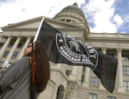 Leah Hogsten  |  The Salt Lake Tribune
Michelle Arnold of Magna holds a flag that reads "The 2nd Ammendment: America's Original Homeland Security." The Pro Gun, Pro Constitution, Anti-tyranny Rally supporters gathered on the Utah Capitol south steps on the anniversary of Patriots Day, Friday, April 19, 2014.