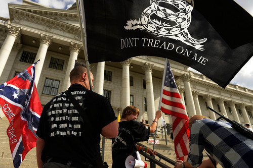 Leah Hogsten  |  The Salt Lake Tribune
Supporters from the Oath Keepers organization who did not want to be identified attended the rally heavily armed with flags and guns. The Pro Gun, Pro Constitution, Anti-tyranny Rally supporters gathered on the Utah Capitol south steps on the anniversary of Patriots Day, Friday, April 19, 2014.
