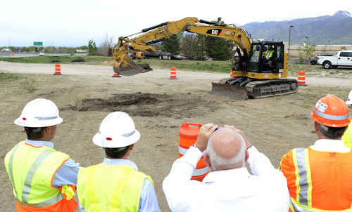 Rick Egan  |  The Salt Lake Tribune

Commissioner Jeff Holt operates the machinery for the ceremonial dig in Bountiful, to begin the I-15 South Davis Project, to add express lanes from North Salt Lake to Farmington, and redo interchanges and bridges, Friday, April 18, 2014