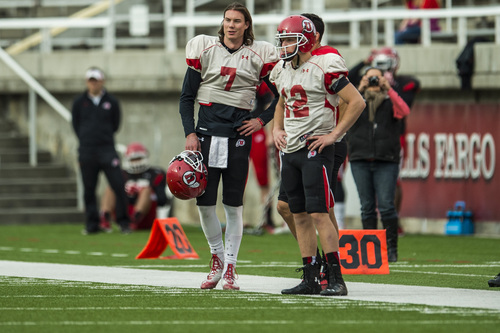 Chris Detrick  |  The Salt Lake Tribune
Utah Utes quarterback Travis Wilson (7) and Utah Utes quarterback Adam Schulz (12) during a scrimmage at Rice-Eccles Stadium Saturday April 5, 2014.