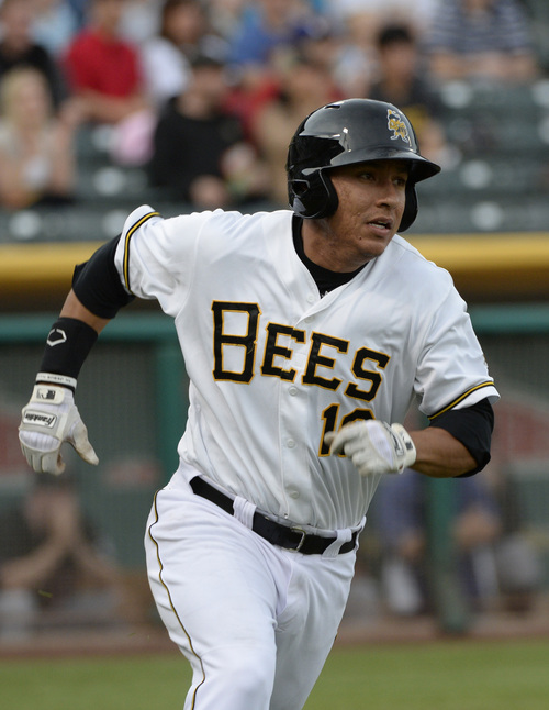 Rick Egan  |  The Salt Lake Tribune

Salt Lake Bees first baseman Efren Navarro (16) races to first base not a long hit he stretched into a double, in Pacific Coast League action, The Salt Lake Bees, vs The Albuquerque Isotopes, at Smiths Ballpark,  Monday, April 21, 2014