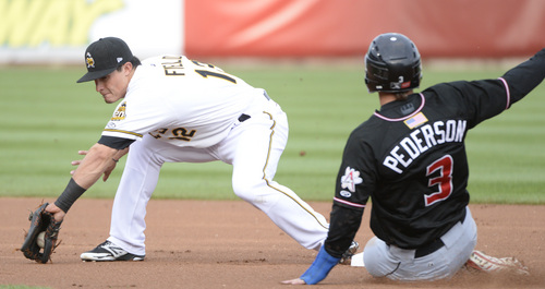 Rick Egan  |  The Salt Lake Tribune

Salt Lake Bees second baseman Tommy Field (12) grabs the throw as, Albuquerque Isotopes outfielder Joc Pederson (3) slides safely into second for a stolen base, in Pacific Coast League action, The Salt Lake Bees, vs The Albuquerque Isotopes, at Smiths Ballpark,  Monday, April 21, 2014