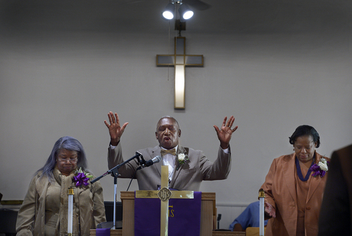 Scott Sommerdorf   |  The Salt Lake Tribune
Trinity African Methodist Episcopal Church was host to an interdenominational sunrise service Easter Sunday, April 20, 2014. The Rev. France Davis, center, of Calvary Missionary Baptist spoke at the small historic church. The service included members of United Methodist, Episcopal, and Calvary Baptist. To the left is Rev. Nurjhan B. Govan of Trinity, and at right is Vinnetta Golphin-Wilkerson, Pastor at Granger Community Church in West Valley City.