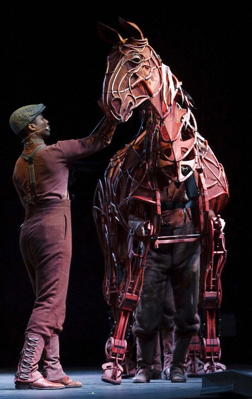 Leah Hogsten | The Salt Lake Tribune
l-r War Horse puppeteer Jude Sandy works the head and sounds, Isaac Woofter works the legs, heart and lungs inside  and Lute Breuer works the hind legs and tail section to bring the horse puppet to life. Joey, the life-sized puppet staring in the Broadway play WarHorse coming to Capitol Theatre, April 22-27, 2014 made his debut in Salt Lake City at The Complex, Tuesday, October 8, 2014. Joey is a life-sized puppet, operated by three puppeteers, constructed by the Handspring Puppet Company that brings breathing, galloping, and charging horses to thrilling life on stage in the National Theatre of Great Britain's production of War Horse.