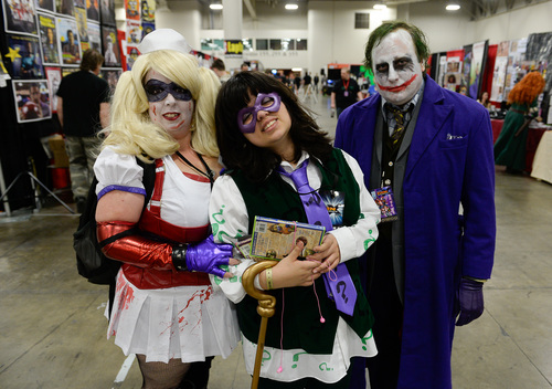Franciso Kjolseth  |  The Salt Lake Tribune
Jennifer Elliot is joined by her daughter Kaitlyn and husband Thomas in costumes as "Harley Quinn, Riddler and the Joker," as they join the thousands of fiction fans from near and far gather at the  Salt Palace Convention Center for day two of Salt Lake Comic Con's FanX.