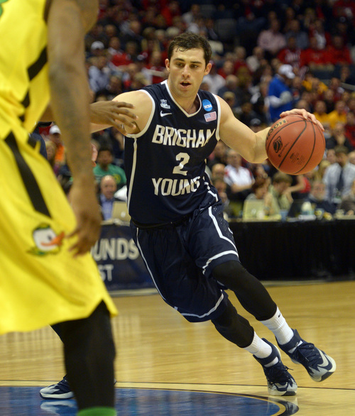 Rick Egan  | The Salt Lake Tribune 

Brigham Young Cougars guard Matt Carlino (2) takes the ball around the key, in second round NCAA Championship action, BYU vs. Oregon, in Milwaukee, Thursday, March 20, 2014.
