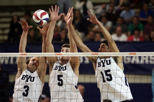 Kim Raff  |  The Salt Lake Tribune
BYU players (from left) Ryan Boyce, Russ Lavaja, and Taylor Sander block a spike by a UCLA player during the semifinals of the MPSF Volleyball Tournament at the Smith Fieldhouse in Prove on April 25, 2013.  BYU went on to win the match 3-2 after trailing UCLA by two sets.