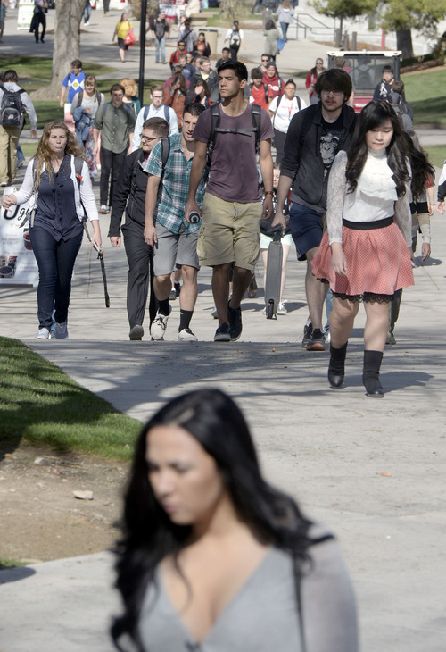 Al Hartmann  |  The Salt Lake Tribune
University of Utah students head to class on April 8.  Thestudent government on Tuesday, April 22, 2014, voted to urge universityadministrators to change lyrics for the school's fight song, "Utah Man." Some lyrics of "Utah Man" can be considered sexist and racist.