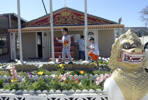 Al Hartmann  |  The Salt Lake Tribune
Children play outside a converted garage in West Valley City that serves as a Buddhist temple. Cambodian community members and friends they are raising money to build a much larger temple and multipurpose building, called Sala Chhan, behind this existing facility.