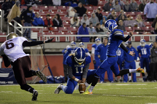 Chris Detrick  |  The Salt Lake Tribune
Bingham's Chayden Johnston (12) kicks a point after touchdown during the 5A semifinal game at Rice-Eccles Stadium Friday November 15, 2013. Bingham is winning the game 35-6 at halftime.