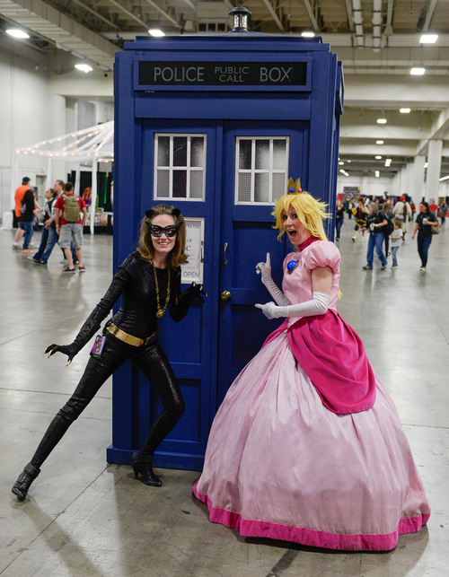 Franciso Kjolseth  |  The Salt Lake Tribune
Heidi Mason as "Catwoman," and Winter Thayne as "Princess Peach," get their Dr. Who on as they join thousands of fiction fans from near and far gathered at the  Salt Palace Convention Center for day two of Salt Lake Comic Con's FanX.