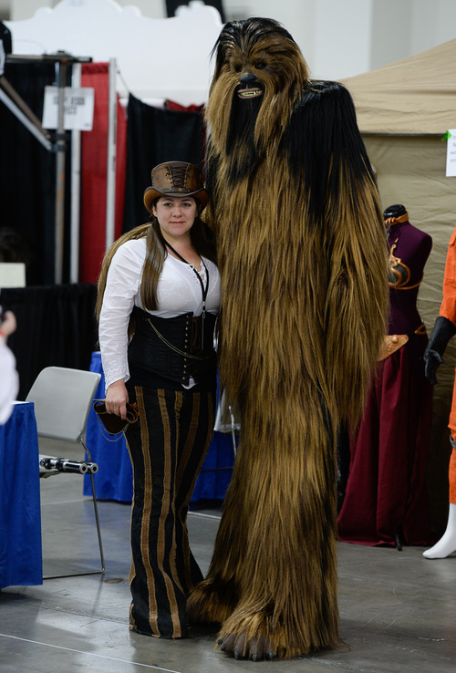 Franciso Kjolseth  |  The Salt Lake Tribune
Monique Buckner gets a picture taken with Philp Barerither as the "wookie Shorbecca," as thousands of fiction fans from near and far gather at the Salt Palace Convention Center for day two of Salt Lake Comic Con's FanX.