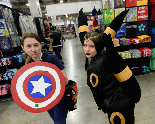 Franciso Kjolseth  |  The Salt Lake Tribune
Sasha Stokes strikes a pose as a "Summer Soldier," alongside Tiffanie Bowcutt as "Umbreon from Pokemon," at the Salt Palace Convention Center for day two of Salt Lake Comic Con's FanX.