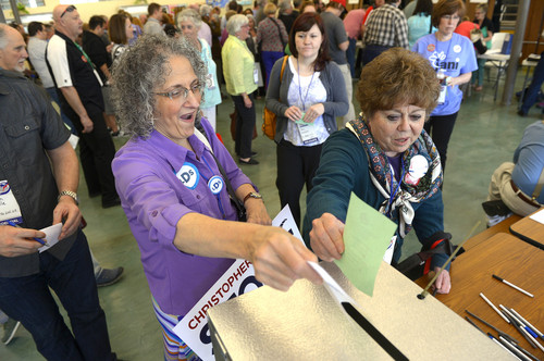 Leah Hogsten  |  Tribune file photo
l-r Carol Evans of Taylorsville and Jan Ferre of Salt Lake City cast their ballots for candidates at the recent Salt Lake County Democratic Convention.  Many of the same delegates -- and many more -- will be attending the state Democratic Convention Saturday.