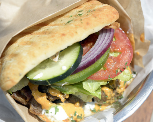 Al Hartmann  |  The Salt Lake Tribune
Street Cart Doner with beef and lamb on foccacia bread is a poular item at
 Spitz's, a restaurant that opened about 6 months ago in downtown Salt Lake City that specializes in doner kebabs.  On a typical weekday lunch the place is packed.