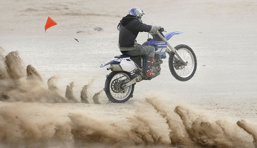 Scott Sommerdorf  |  Salt Lake Tribune
LITTLE SAHARA
A rider's paddle tires churn up the sand as it prepares to power up "Sand Mountain" at Little Sahara National Recreation Area, Saturday 4/3/10. Four- and two-wheel enthusiasts, dune buggies and more kick off the spring season with motorized recreation and camping at Little Sahara sand dunes., Saturday 4/3/10.