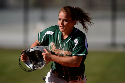 Trent Nelson  |  The Salt Lake Tribune
Reagan Everett is a sophomore softball player at Olympus High. She plays left field and bats at the bottom of the order. Everett is also diagnosed with Li-Fraumeni syndrome, a rare auto-immune disorder that suppresses the body's ability to detect and destroy cancer cells at their conception. As a result, her body is riddled with cancer, but she continues to play ball. Everett's family has had 27 members diagnosed with Li-Fraumeni syndrome and 24 members have died. She is well aware that she has a limited amount of time left before the cancer takes her but she remains an almost 4.0 student (even with 6 months of home schooling after brain surgery to remove a tumor). She was photographed in action against Murray, at Olympus High School, Thursday April 17, 2014.
