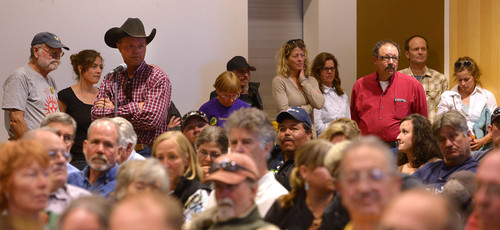 Leah Hogsten  |  The Salt Lake Tribune
Residents who wished to address their concerns and opinions waited their turn to speak in the standing room only meeting.The Grand County Council Public Lands Working Committee got an earful from Grand County residents who voiced their concerns  for long term designations of public lands within the county, Wednesday, April 23, 2014.  Three alternative plans were created for consideration as part of U. S. Congressman Rob Bishop's public lands bill initiative.