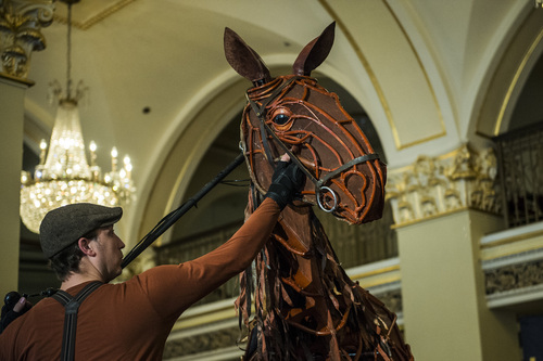 Chris Detrick  |  The Salt Lake Tribune
Joey, the horse puppet from the touring show of "War Horse," at the Capitol Theatre Wednesday April 23, 2014. Joey's puppeteers are James Duncan, head, Brian Burns, heart, and Aaron Haskeii, hind. The puppet weighs 120 pounds, with a frame of mostly cane that was soaked, bent and stained; it was made by a team of 14 people. An aluminum frame along the spine, lined partly with leather, allows the horse to be ridden.