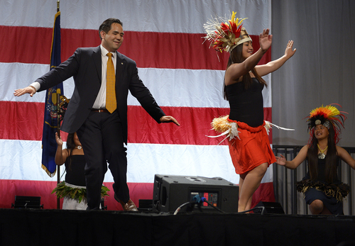 Scott Sommerdorf   |  The Salt Lake Tribune
Utah Attorney General Sean Reyes dances with a dance group from American Somoa at the Western Republican Leadership Conference as they held a rally at the South Towne Convention Center, Friday, April 25, 2014.