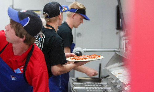 Trent Nelson  |  Tribune file photo
Robbie Nelson, Tuker Spanbauer and Marc Aust work on pizzas at a Domino's Pizza location in Lehi Thursday, May 2, 2013. Domino's said in April 2014 that it would be hiring 150 new employees in the Salt Lake area.