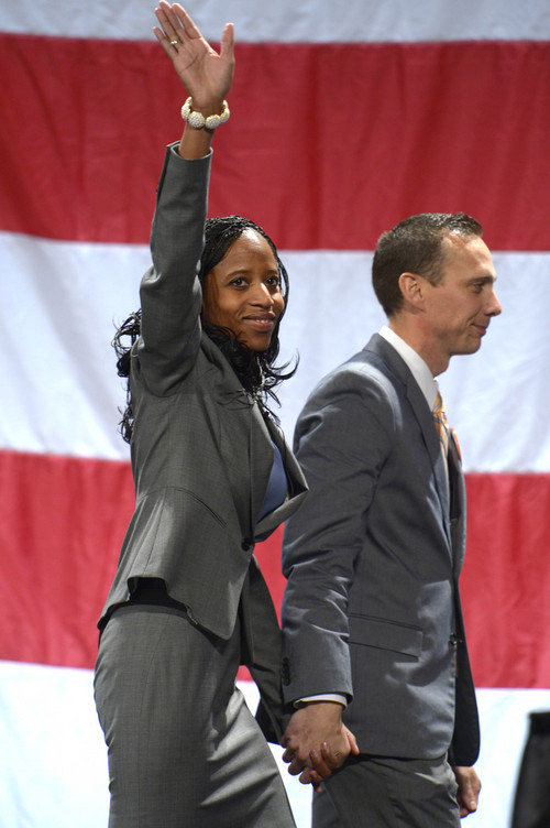 Leah Hogsten  |  The Salt Lake Tribune
4th Congressional District candidate Mia Love, with husband Jason, won the Republican nomination with 78 percent of the votes at the Utah GOP Convention at the South Towne Expo Center on Saturday.