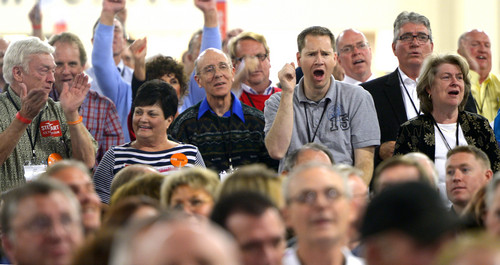 Leah Hogsten  |  The Salt Lake Tribune
Delegates show their support for state control of public lands and preserving the caucus-convention system at the Utah Republican Party 2014 Nominating Convention at the South Towne Expo Center on Saturday.