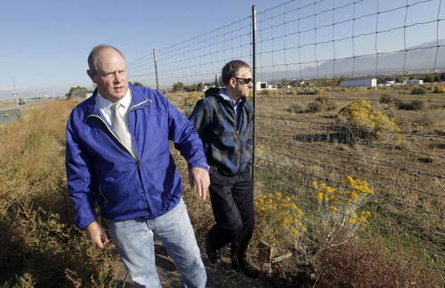Al Hartmann  |  The Salt Lake Tribune
Bluffdale City Manager Mark Reid, left, and Grant Crowell, city planner/economic development director, look over an 80-acre private-property parcel along Redwood Road north of the NSA Utah Data Center Oct. 15. The city would like to see the area developed into a commercial business center.