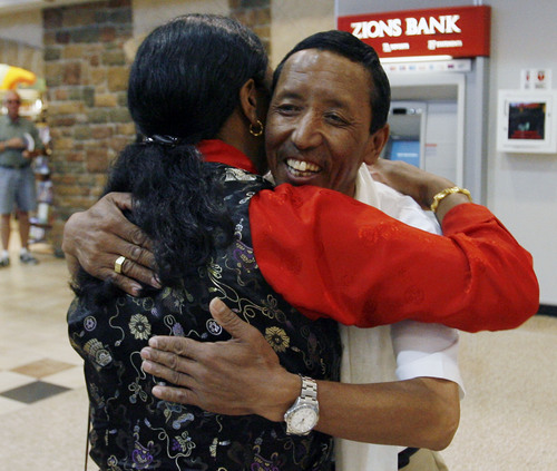 Tribune file photo | Steve Griffin
Apa Sherpa gets a big hug from his wife, Yahgji, in 2009 as he returns from Nepal where he successfully added to his world record for climbing Mt. Everest with his 19th summit. He was met at the Salt Lake International Airport by his family and friends on  Friday, May 29, 2009.