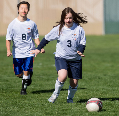 Trent Nelson  |  The Salt Lake Tribune
Brighton's Andy Melville and Kira Hooyer in action vs. Alta High School in Sandy, Wednesday April 23, 2014. In Unified Soccer, high school athletes who have intellectual disabilities team with partners in 5-on-5 games.