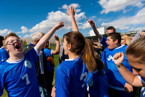 Trent Nelson  |  The Salt Lake Tribune
Bingham's Josh Rothey and teammates high-five after a win over Jordan High School in Sandy, Wednesday April 23, 2014. In Unified Soccer, high school athletes who have intellectual disabilities team with partners in 5-on-5 games.