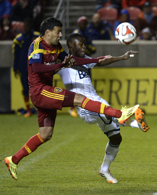 Rick Egan  |  The Salt Lake Tribune

Javier Morales (11), as he goes for the ball, along with Vancouver FC midfielder Gershon Koffie (28) in MLS action, Real Salt Lake vs. The Vancouver Whitecaps, Wednesday, April 23, 2014