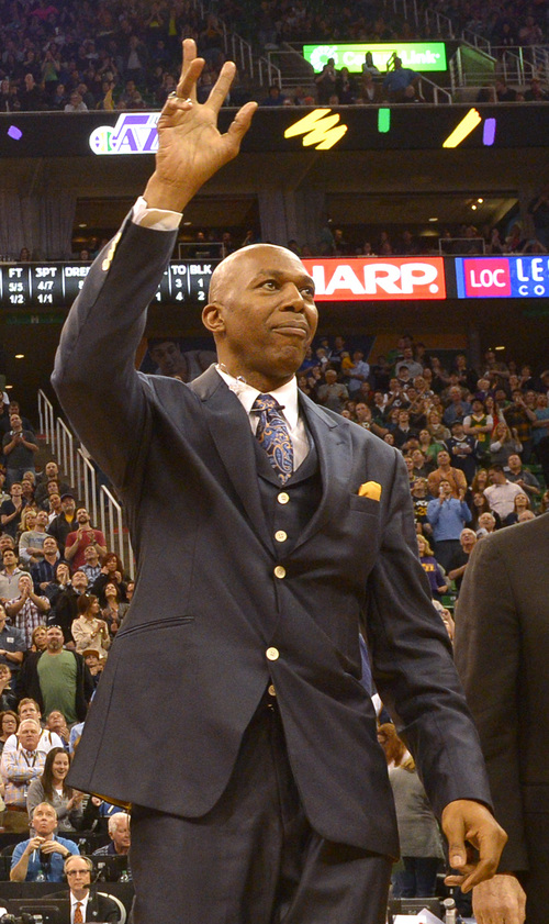 Rick Egan  | The Salt Lake Tribune 

Thurl Bailey former Utah Jazz player from the1983-84 team, waves to the crowd, during a break in the action, during the Utah Jazz, Orlando Magic game, at EnergySolutions Arena Saturday, March 22, 2014.