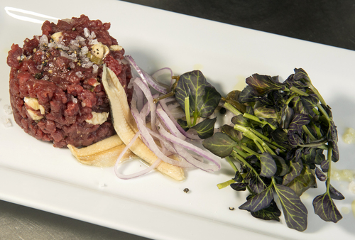 Rick Egan  |  The Salt Lake Tribune

The Spring menu at Ogden's Hearth on 25th includes a grass-fed Himalayan yak tartare with white anchovies, caper berries, red onion and watercress.