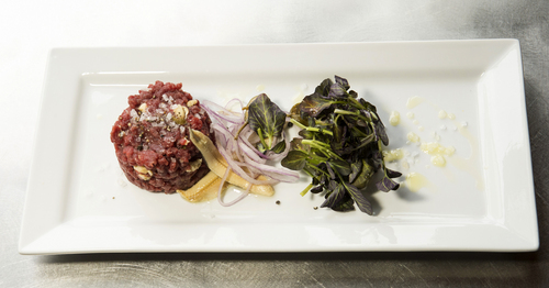 Rick Egan  |  The Salt Lake Tribune

The Spring menu at Ogden's Hearth on 25th includes a grass-fed Himalayan yak tartare with white anchovies, caper berries, red onion and watercress.