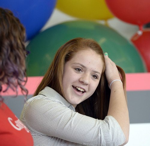 Al Hartmann  |  The Salt Lake Tribune
Olympus High School10th-grader Bronte Mack takes the stage at the school on Tuesday as she is announced as the Utah winner in the seventh annual Doodle 4 Google competition.