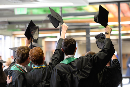 Franciso Kjolseth  |  The Salt Lake Tribune
With caps held high for a group picture, the class of 2014 at Utah Valley University lines up for commencement ceremonies at the UCCU Center on Thursday, May 1.