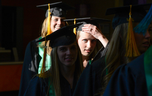 Franciso Kjolseth  |  The Salt Lake Tribune
The 2014 class at Utah Valley University walks the halls of campus on their way to commencement ceremonies at the UCCU Center on Thursday, May 1, in Orem.