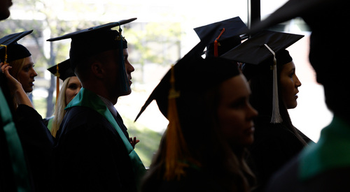 Franciso Kjolseth  |  The Salt Lake Tribune
The 2014 class at Utah Valley University walks the halls of campus on their way to commencement ceremonies at the UCCU Center on Thursday, May 1, in Orem.