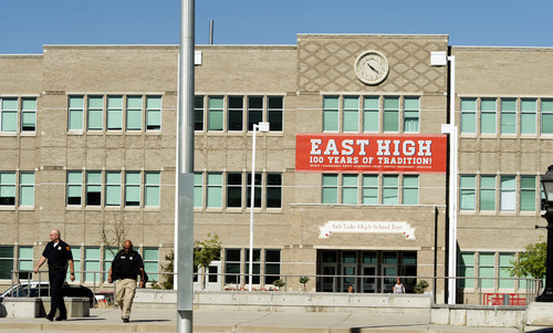 Rick Egan  |  The Salt Lake Tribune

A couple of policemen leave East High after a lockdown due to a bomb threat, Thursday, May 1, 2014