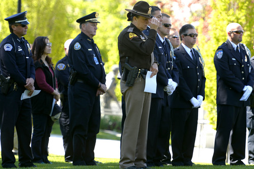 Leah Hogsten  |  The Salt Lake Tribune
UHP trooper Michelle McLaughlin (center) and other fellow law enforcement members attend the ceremony. Draper Police Sgt. Derek Johnson and Utah County Sheriff's Sgt. Cory Wride's names  were added to the Utah Fallen Officer Memorial in a ceremony, Thursday, May 1, 2014 on the State Capitol grounds.