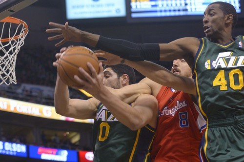 Leah Hogsten  |  The Salt Lake Tribune
l-r Utah Jazz center Enes Kanter (0), Los Angeles Clippers forward Hedo Turkoglu (8) and Utah Jazz forward Jeremy Evans (40) fight for the rebound. Utah Jazz lead the Los Angeles Clippers 51-43 at the half during their game, Friday, March, 14, 2014 at Energy Solutions Arena.