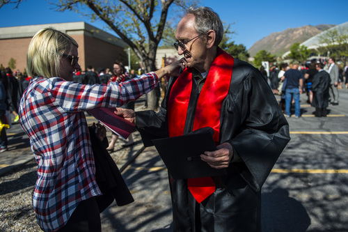 Chris Detrick  |  The Salt Lake Tribune
Channing Sargent talk to her dad James Sterling, 69, who is graduating with a degree in English, outside of the Huntsman Center before the University of Utah's 2014 Commencement Ceremonies Thursday May 1, 2014.