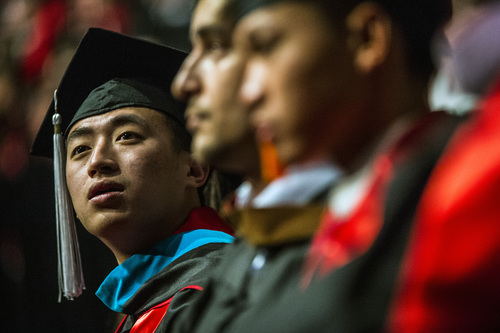 Chris Detrick  |  The Salt Lake Tribune
Kun Huang, who majored in economics, listens during during the University of Utah's 2014 Commencement Ceremonies at the Huntsman Center Thursday May 1, 2014.